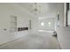 Bright living room features modern light fixture, recessed shelves, and scenic outdoor views from the windows at 404 Fairington Dr, Summerville, SC 29485