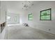 Bright, open living room features modern chandelier, recessed lighting, and scenic outdoor views from the windows at 404 Fairington Dr, Summerville, SC 29485