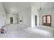 Spacious living room featuring recessed lighting, modern chandelier, wood door, and view to a bathroom at 404 Fairington Dr, Summerville, SC 29485
