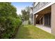 Landscaped backyard with white fence and stairs leading to the house provides privacy at 407 Pitt St, Mount Pleasant, SC 29464