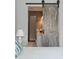 Bedroom view highlighting sliding barn door to bathroom at 407 Pitt St, Mount Pleasant, SC 29464