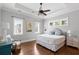 Spacious bedroom features tray ceiling, plush bedding, and natural light at 407 Pitt St, Mount Pleasant, SC 29464