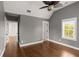 Bedroom features hardwood floors, a ceiling fan, and natural light at 407 Pitt St, Mount Pleasant, SC 29464