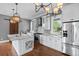 Well-equipped kitchen boasts stainless steel appliances, ample counter space, and a stylish center island at 407 Pitt St, Mount Pleasant, SC 29464