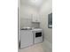 Well-organized laundry room includes washer, dryer, and storage cabinets at 407 Pitt St, Mount Pleasant, SC 29464