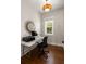 Bright office features a modern desk, stylish mirror, and hardwood floors at 407 Pitt St, Mount Pleasant, SC 29464