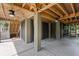 Open outdoor space with ceiling fans and exposed beams is great for entertaining at 407 Pitt St, Mount Pleasant, SC 29464