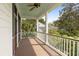 Spacious covered porch with natural light is perfect for entertaining or relaxing outdoors at 407 Pitt St, Mount Pleasant, SC 29464
