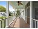 Inviting covered porch with wood flooring and ceiling fan offers a relaxing outdoor space at 407 Pitt St, Mount Pleasant, SC 29464