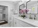 Bright bathroom with double vanity, quartz countertop and modern fixtures at 481 Woodland Shores Rd, Charleston, SC 29412