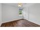 Cozy bedroom with luxury vinyl plank flooring and a street view at 481 Woodland Shores Rd, Charleston, SC 29412