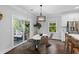 Dining area features hardwood floors, lots of natural light, modern chandelier and stainless steel appliances at 481 Woodland Shores Rd, Charleston, SC 29412