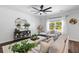 Bright and open living room with shiplap accent wall, stylish decor, and a beautiful view outside the window at 481 Woodland Shores Rd, Charleston, SC 29412