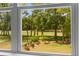 Picturesque view of the golf course and backyard from the home's window at 481 Woodland Shores Rd, Charleston, SC 29412