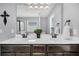Bathroom vanity featuring double sinks, stylish faucets, and contemporary lighting fixtures offers convenience at 482 Sanders Farm Ln, Wando, SC 29492