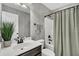 Modern bathroom with stylish wallpaper, vanity, and shower at 482 Sanders Farm Ln, Wando, SC 29492