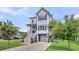 Charming coastal home with a garage, elevated living space, and a well-maintained front yard at 482 Sanders Farm Ln, Wando, SC 29492
