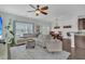 Spacious living room features hardwood floors, neutral decor, and an open concept layout at 482 Sanders Farm Ln, Wando, SC 29492