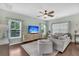 Inviting living room with hardwood floors, neutral decor, and lots of natural light at 482 Sanders Farm Ln, Wando, SC 29492