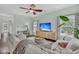 Comfortable living room with a ceiling fan, hardwood floors, neutral decor, and natural light at 482 Sanders Farm Ln, Wando, SC 29492