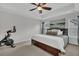 Tranquil main bedroom features tray ceilings, plush carpeting, and a large window offering ample natural light at 482 Sanders Farm Ln, Wando, SC 29492