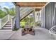 Outdoor patio area with a picnic table and string lights at 482 Sanders Farm Ln, Wando, SC 29492