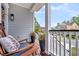 Cozy porch with rocking chairs, decorative pillows, and neighborhood views at 482 Sanders Farm Ln, Wando, SC 29492