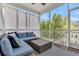 Cozy porch with plush seating and a view of trees at 482 Sanders Farm Ln, Wando, SC 29492