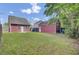 Spacious backyard featuring a lush lawn and detached garage at 4856 Cane Pole Ln, Summerville, SC 29485