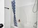 Clean bathroom with a white shower and a blue patterned shower curtain at 4856 Cane Pole Ln, Summerville, SC 29485