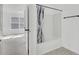 Bright bathroom features a shower over tub and neutral tones at 4856 Cane Pole Ln, Summerville, SC 29485