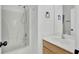 Spotless bathroom features a shower-tub combo, modern fixtures, and vanity with a wood cabinet and sink at 4856 Cane Pole Ln, Summerville, SC 29485