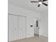 Bright bedroom featuring a ceiling fan and a closet with bi-fold doors, offering ample storage at 4856 Cane Pole Ln, Summerville, SC 29485