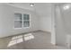 Well-lit bedroom with a large window, offering natural light and a view of the outdoors at 4856 Cane Pole Ln, Summerville, SC 29485