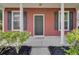 Inviting front porch with manicured bushes and black shutters at 4856 Cane Pole Ln, Summerville, SC 29485