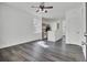 Open-concept living room with modern gray floors offering plenty of space to spread out with natural light and views at 4856 Cane Pole Ln, Summerville, SC 29485