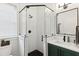 Elegant bathroom featuring a glass shower, modern fixtures, and a dark vanity at 5 Addison St, Charleston, SC 29403