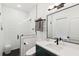 Stylish bathroom with a glass-enclosed shower, sleek fixtures, and a contemporary vanity at 5 Addison St, Charleston, SC 29403