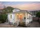 Attractive exterior of the home boasting a well-maintained yard and inviting entrance at 5 Addison St, Charleston, SC 29403