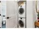 Convenient laundry room features a stacked washer and dryer unit with a modern and space-saving design at 5 Addison St, Charleston, SC 29403