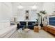 Bright living room featuring modern decor, stylish sofas, large windows, and contemporary accents at 5 Addison St, Charleston, SC 29403