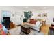 Open-concept living area features hardwood floors, offering a seamless flow between living, dining, and kitchen spaces at 5 Addison St, Charleston, SC 29403