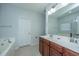 Bathroom featuring double sinks, tile floors, and a soaking tub at 5008 Bowles Dr, Summerville, SC 29485