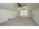 Cozy carpeted attic-like room with neutral paint and one window for you to add your personal touch at 5008 Bowles Dr, Summerville, SC 29485