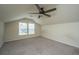 Cozy carpeted attic-like room with neutral paint and two windows for you to add your personal touch at 5008 Bowles Dr, Summerville, SC 29485