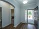 Inviting foyer with hardwood floors, showcasing an open entrance to other rooms and a view of the front yard at 5008 Bowles Dr, Summerville, SC 29485
