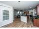 Bright kitchen with granite counters, stainless steel appliances, and an open flow to the living area at 5008 Bowles Dr, Summerville, SC 29485