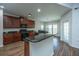 Well-equipped kitchen with granite countertops, dark wood cabinetry, and stainless steel appliances at 5008 Bowles Dr, Summerville, SC 29485