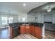 Kitchen bar featuring a sink and dark granite countertop overlooking other living areas at 5008 Bowles Dr, Summerville, SC 29485