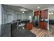Elegant kitchen featuring granite countertops, stainless appliances, and a breakfast bar overlooking living spaces at 5008 Bowles Dr, Summerville, SC 29485